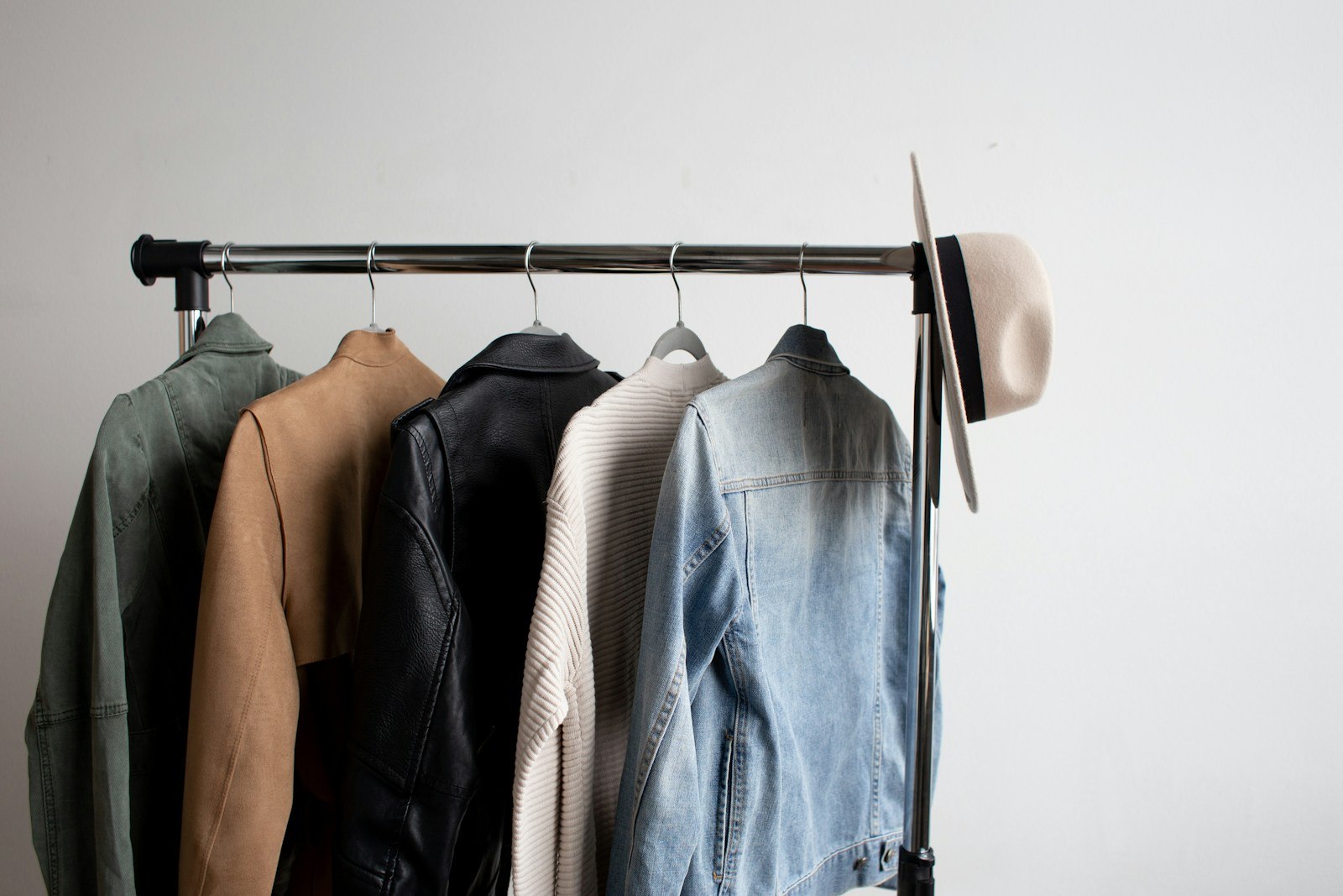 A considered rail of neutral outerwear and knitwear