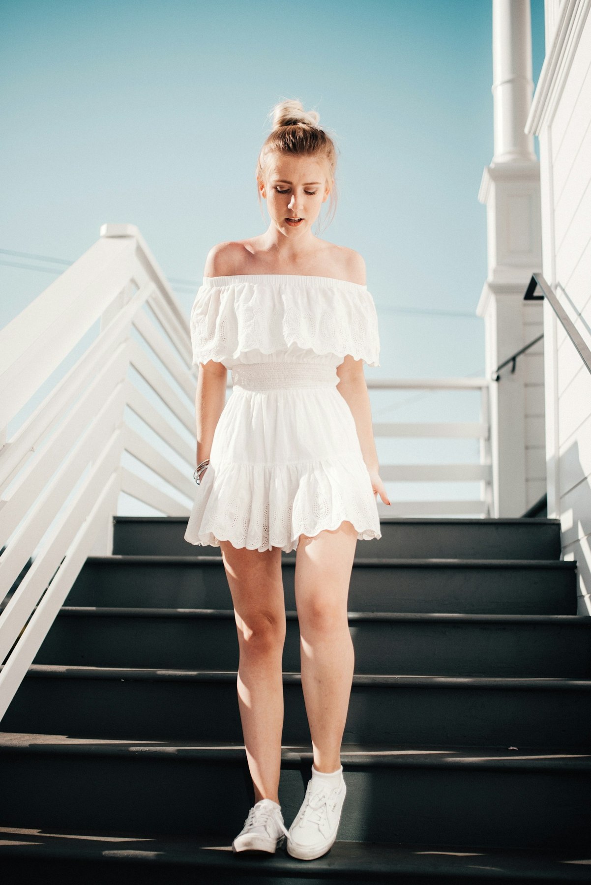 Ivory off-the-shoulder dress with a tiered silhouette